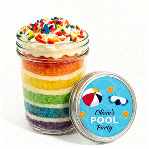 Colorful layered cupcake in a jar with a pool party-themed lid on a white background