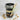 Graduation-themed layered cupcake dessert in a jar with a wooden spoon on a marble surface.