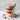 Layered cupcake dessert in a jar with a customizable 'Tonight we PARTY' label on a marble surface with a wooden spoon.