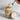 Jar of layered cupcake dessert with a spoonful being lifted, labeled customizable 'Olivia's Bridal Shower' on a marble surface.