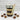 Glass jar with layered cupcake dessert inside, surrounded by mini dessert cups on a white surface.