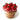 Red apple-shaped cupcakes in a wooden basket on a white background