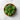 Spring decorative cupcakes with green frosting, colorful butterfly decorations, and a red ladybug on a marble surface.