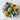 Assorted colorful cupcakes on a marble surface with gratitude toppers.