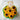 Sunflower-shaped cupcakes in a a bouquet with a personalized card on a marble background