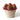 Basket of chocolate cupcakes with red heart decorations on a white background