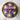 Decorative pot filled with purple and yellow flower-shaped cupcakes on a marble surface