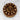 Chocolate cake with rolo candies on a glass plate