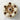 Decorative cake with chocolate balls and nuts on a marble surface