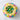 Colorful Easter-themed cake with icing and candy eggs on a marble surface