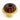 Bundt cake with chocolate glaze on a yellow cake stand against a white background