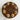 Chocolate cake with spiral design and peanuts sprinkled on a marble surface