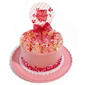 Valentine's Day cake with pink frosting, ruffles, and a 'Happy Valentine's Day' topper.