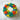 Colorful flower-shaped cake on a marble surface