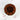 Chocolate cake with brown frosting and red heart decorations on a marble surface.